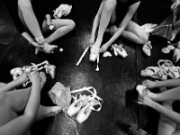 Dancers put on their pointe shoes for class.  Only the more advanced students are able to use pointe shoes.  Pointe class happens three times a week, while the other ballet classes happen every day at the New Bedford Ballet studio on Purchast Street in the north end of New Bedford.   [ PETER PEREIRA/THE STANDARD-TIMES/SCMG ]